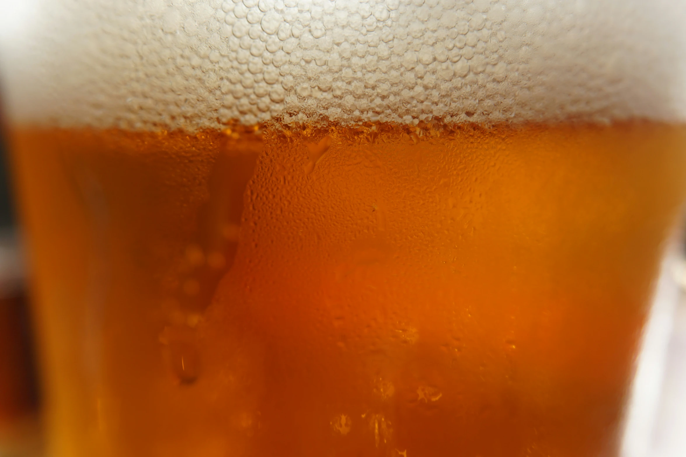 beer is in a glass, closeup, as it's ready to be drank