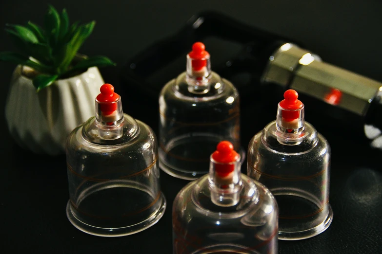 an arrangement of six small bottles are set on a counter