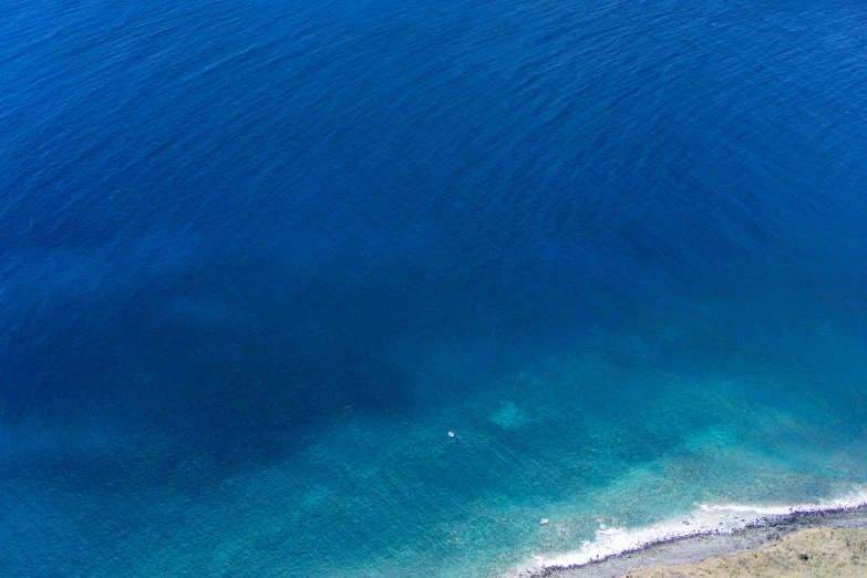 blue waters are shown from above on a sunny day