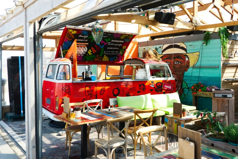 colorful ice cream truck and outdoor seating at a restaurant