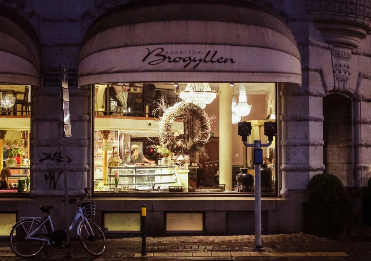 a bicycle parked in front of a jewelry shop