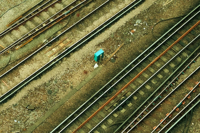 an overhead view of an area where several sets of train tracks meet each other