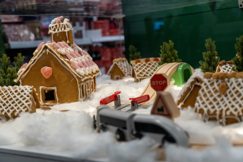 a toy town with toys and building surrounded by snow