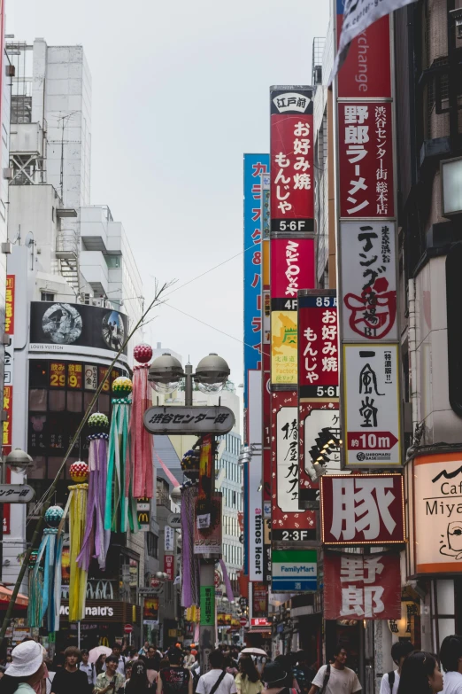 lots of tall buildings near one another with chinese writing