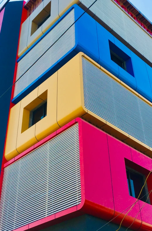 the exterior of an office building is brightly colored