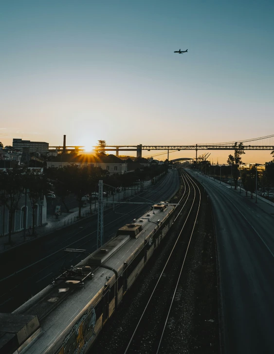 an airplane is flying above the skyline