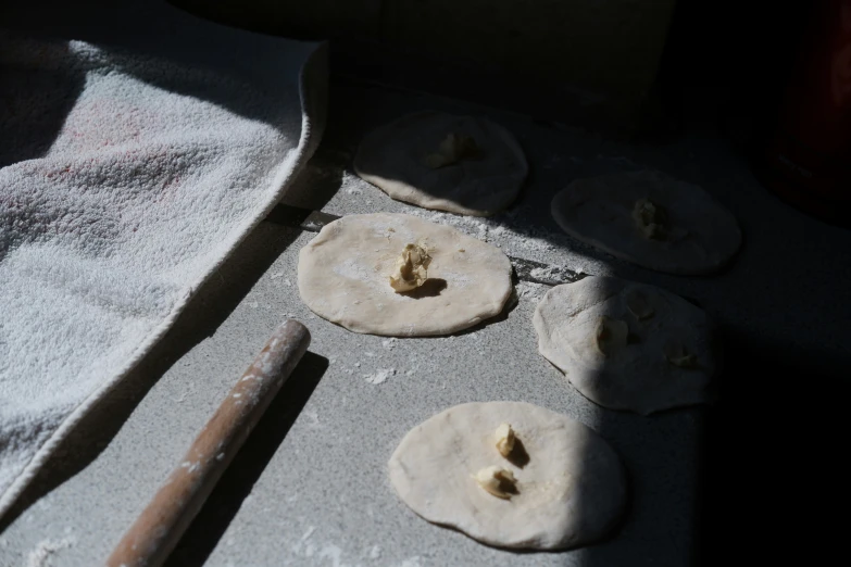 some food is on a pan covered in white flour