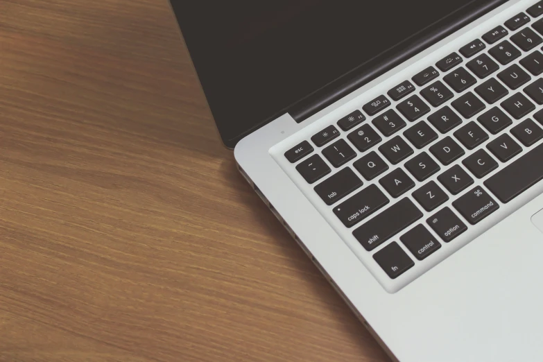 a laptop with two different keyboards sitting on top of it