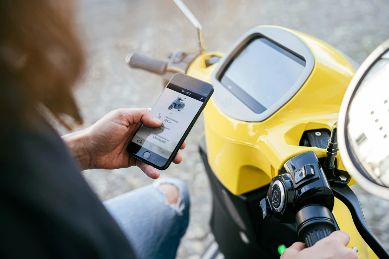 the motor scooter is displaying a clock and dash screen