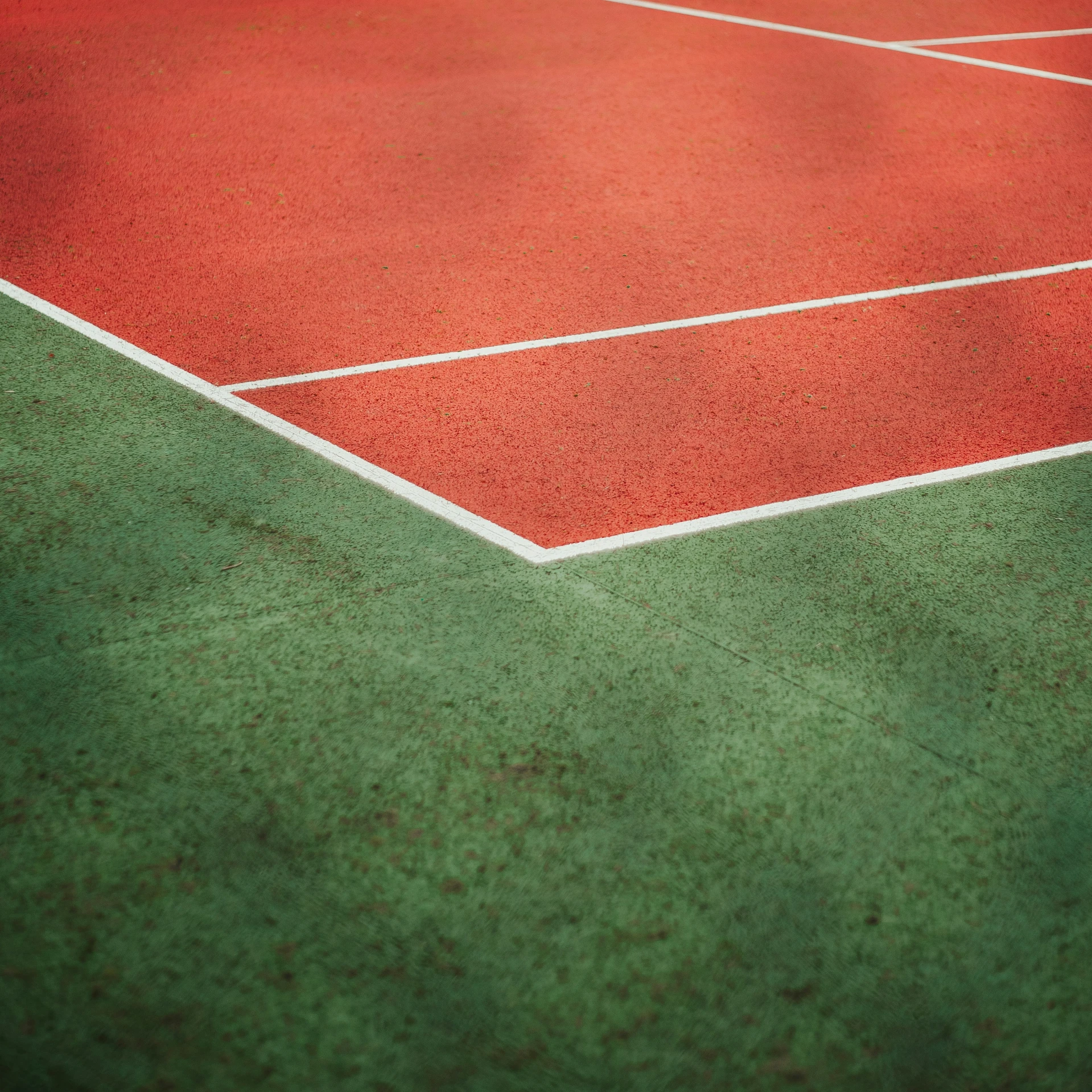 a tennis court with green and red lines