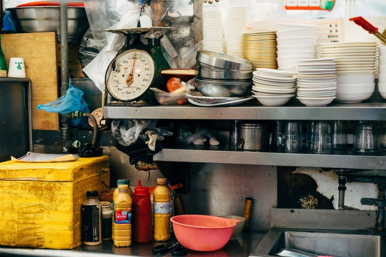 a variety of plates, containers and other kitchen supplies