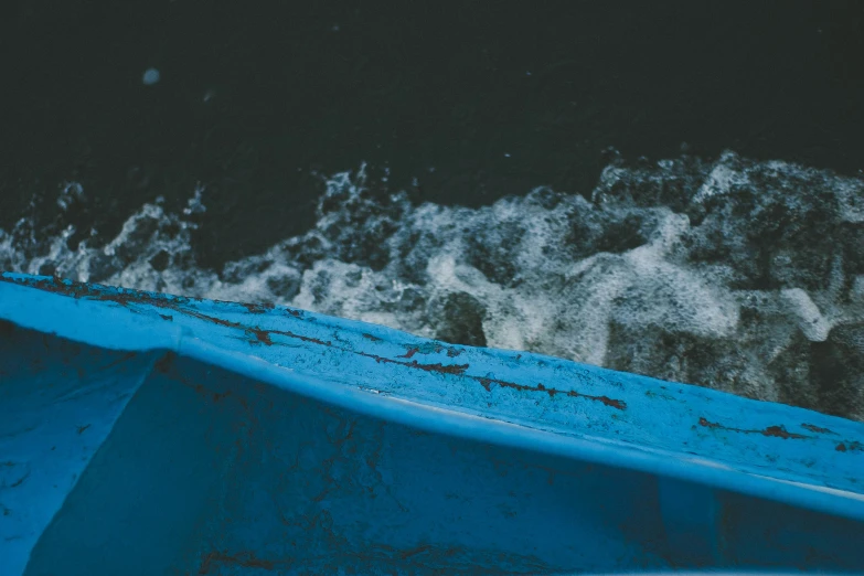 the view from the top of a blue surfboard