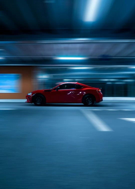 a car driving down the street in a tunnel