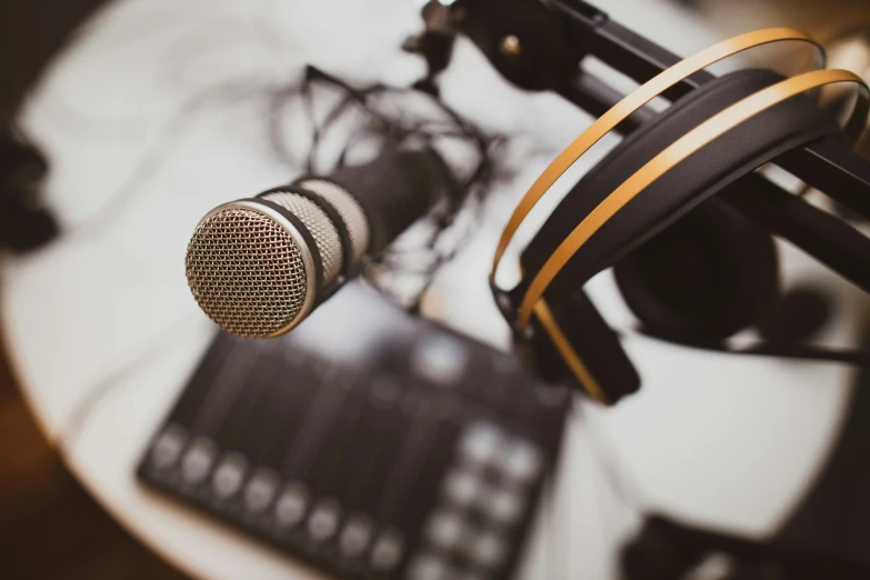 a microphone with headphones sits on a table