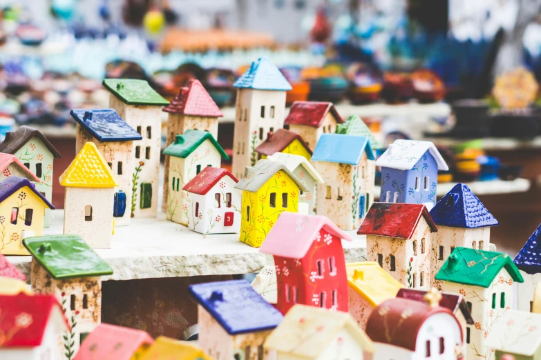 many small wooden houses and buildings on display