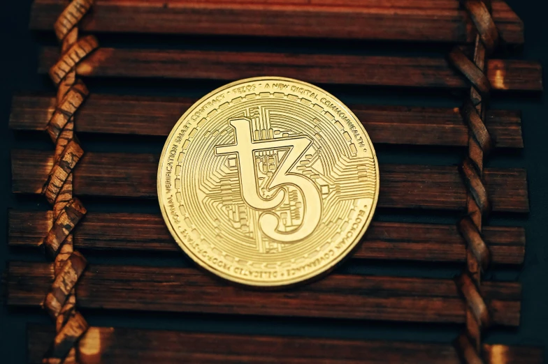 the front of a wooden clock with a coin on top