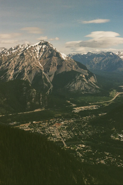 a view of a snow - capped mountain top from an airplane