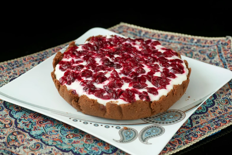 the dessert is decorated with fresh strawberries on top