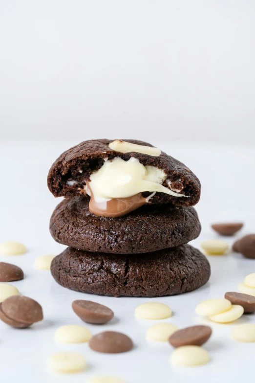 a white plate holding three cookies on it