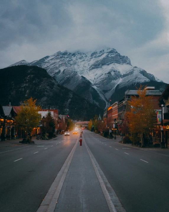 the town is very quiet with the mountains in the background