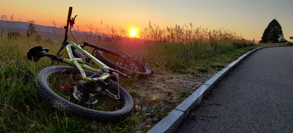 a bike is parked on the side of a country road