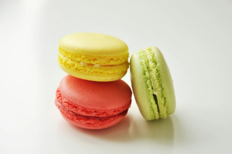 a pile of different kinds of macaroons next to each other