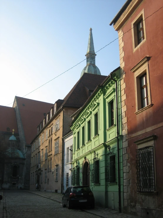 a street lined with tall brick buildings next to each other