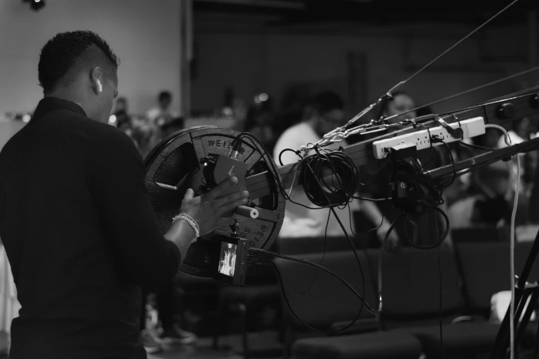 man in suit and tie recording at an event