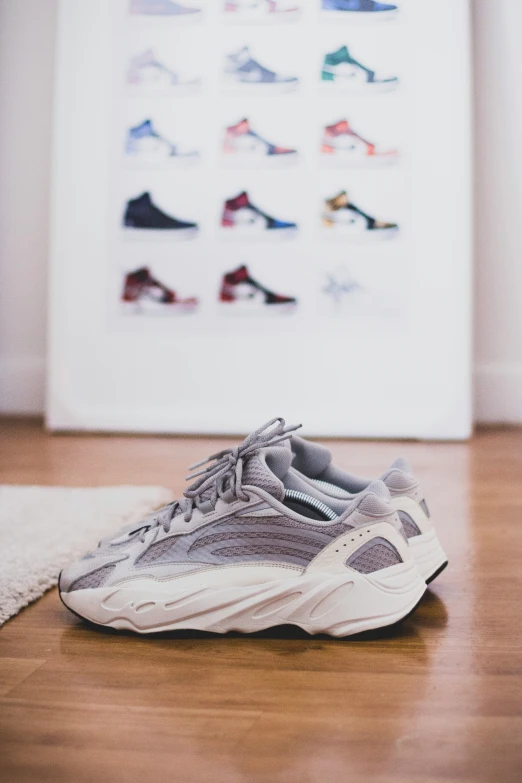 a pair of sneakers sitting on a hardwood floor