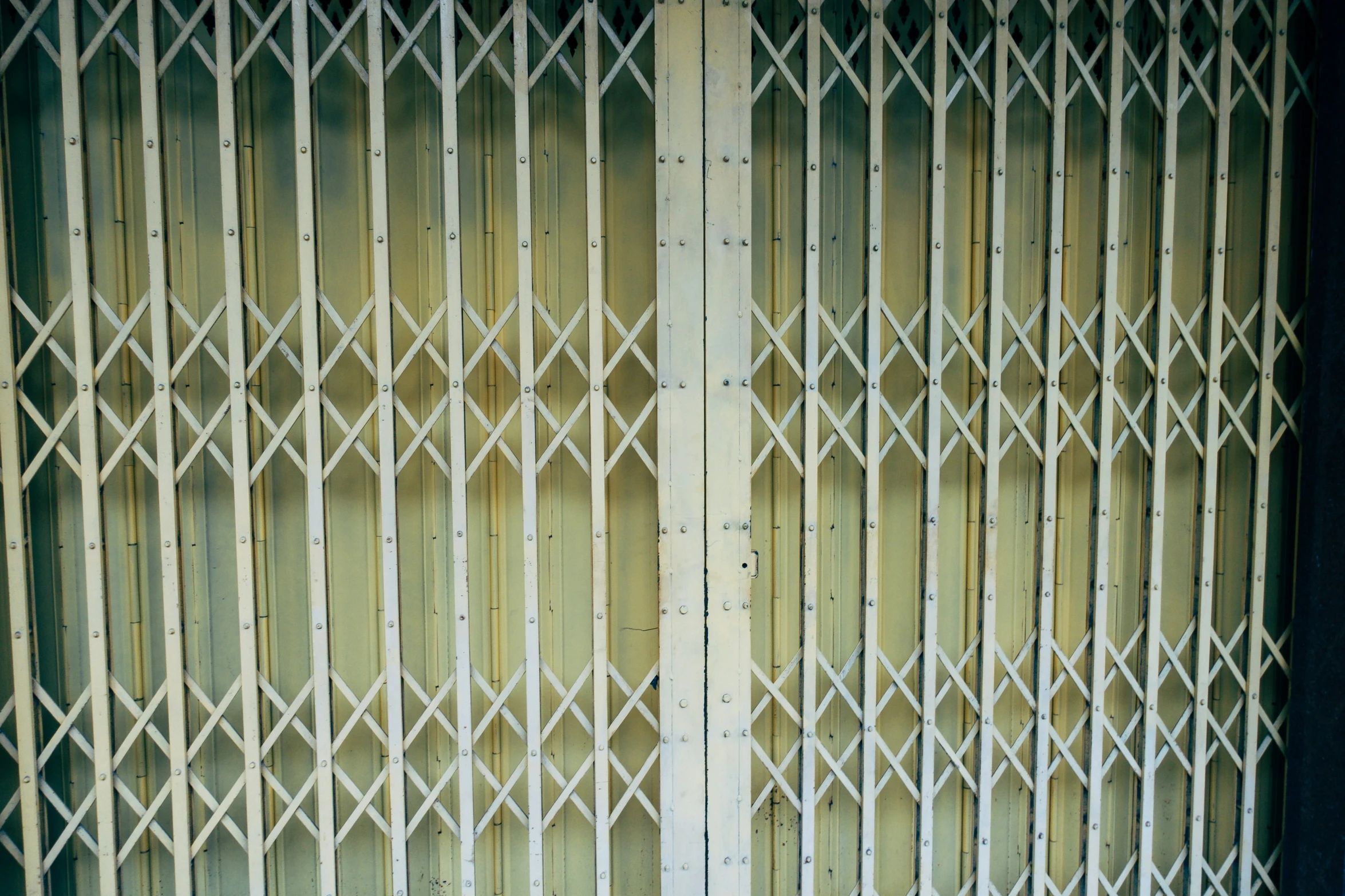 a very tall wooden paneled fence with no top