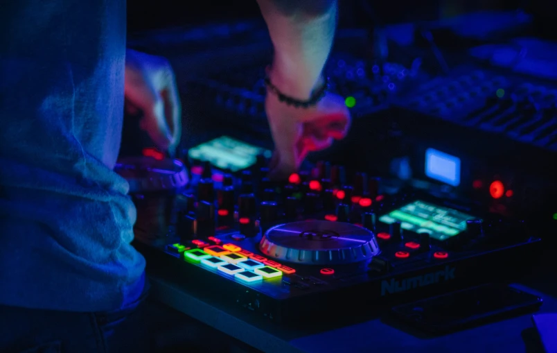 a person mixing music in a sound production unit