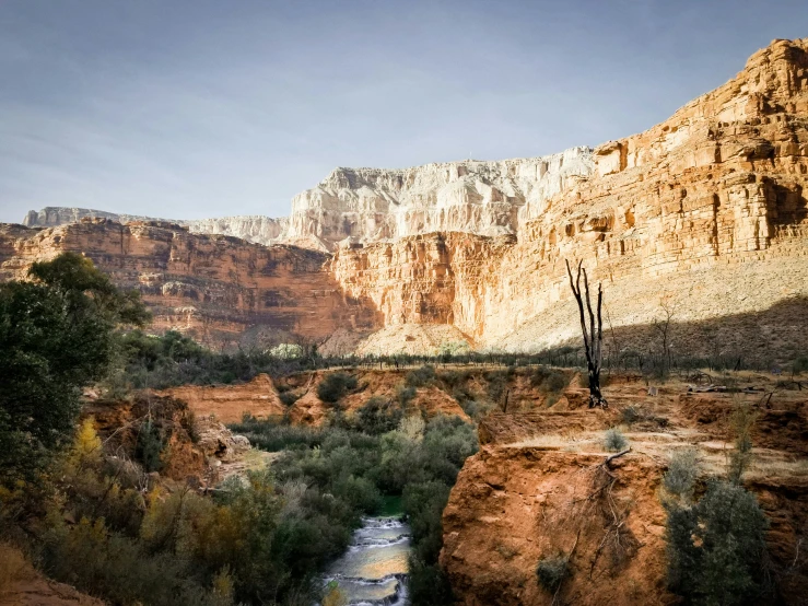 a rocky, canyon like area with a body of water