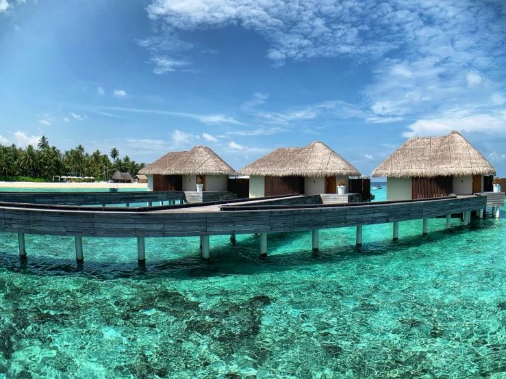 some huts are placed on the top of water