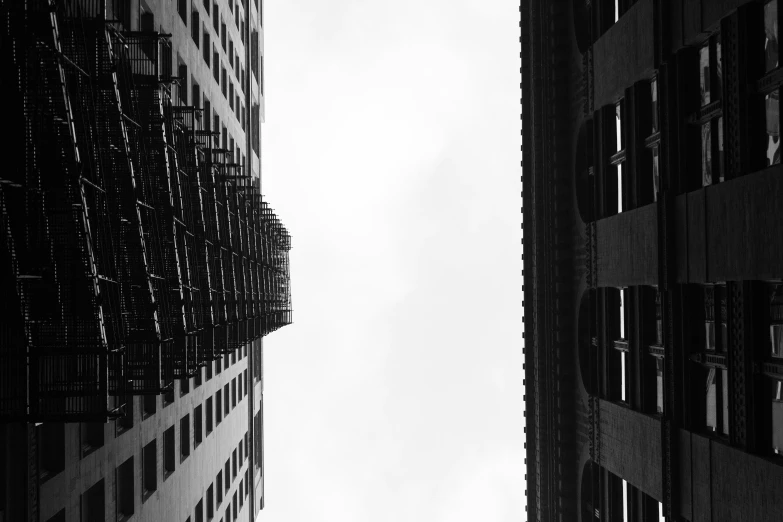 black and white pograph of two buildings in city