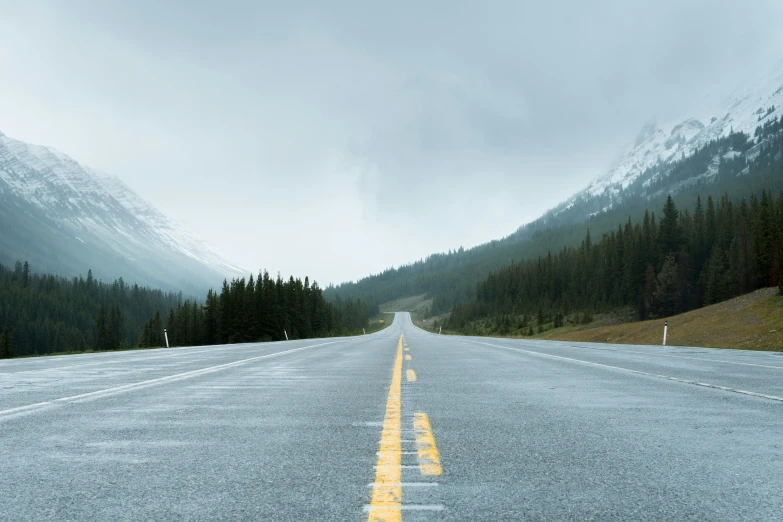 a long road leading through the mountains