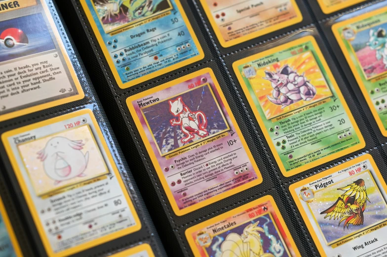 a collection of pokemon cards on display for sale