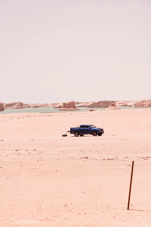 an old pick up truck sits in a desert