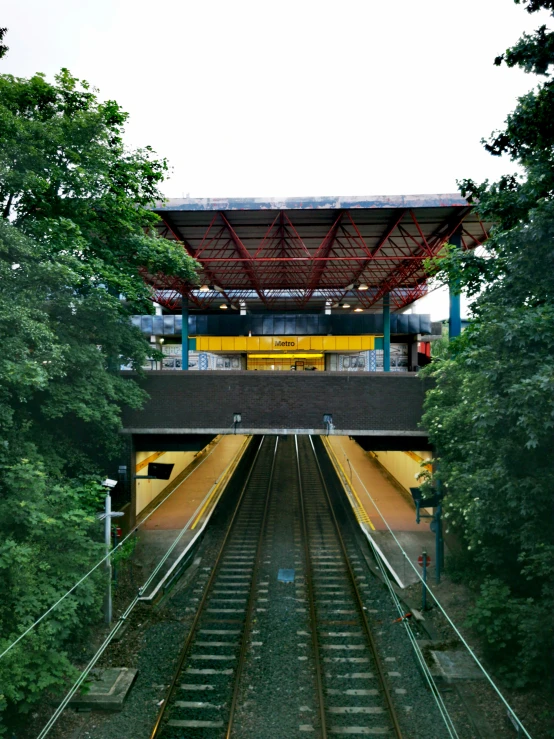 a view of a train track that goes into a building