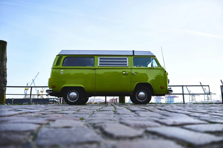 a volkswagen van is parked on the side of a road