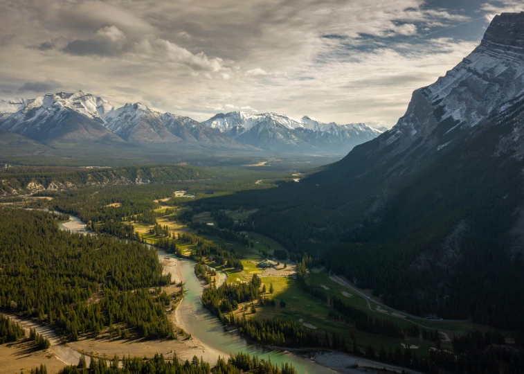 a scenic view of a valley and mountains