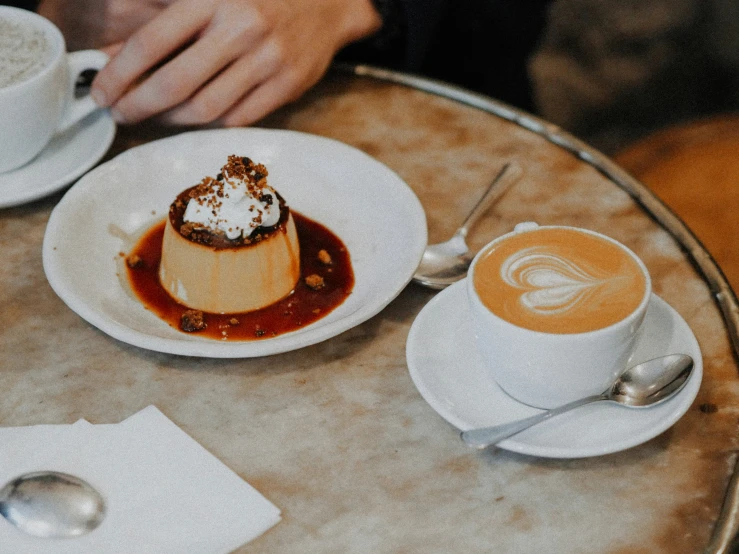 a table topped with two plates filled with dessert