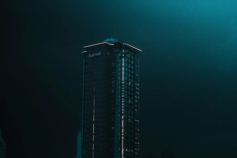 tall building is seen in a very dark room