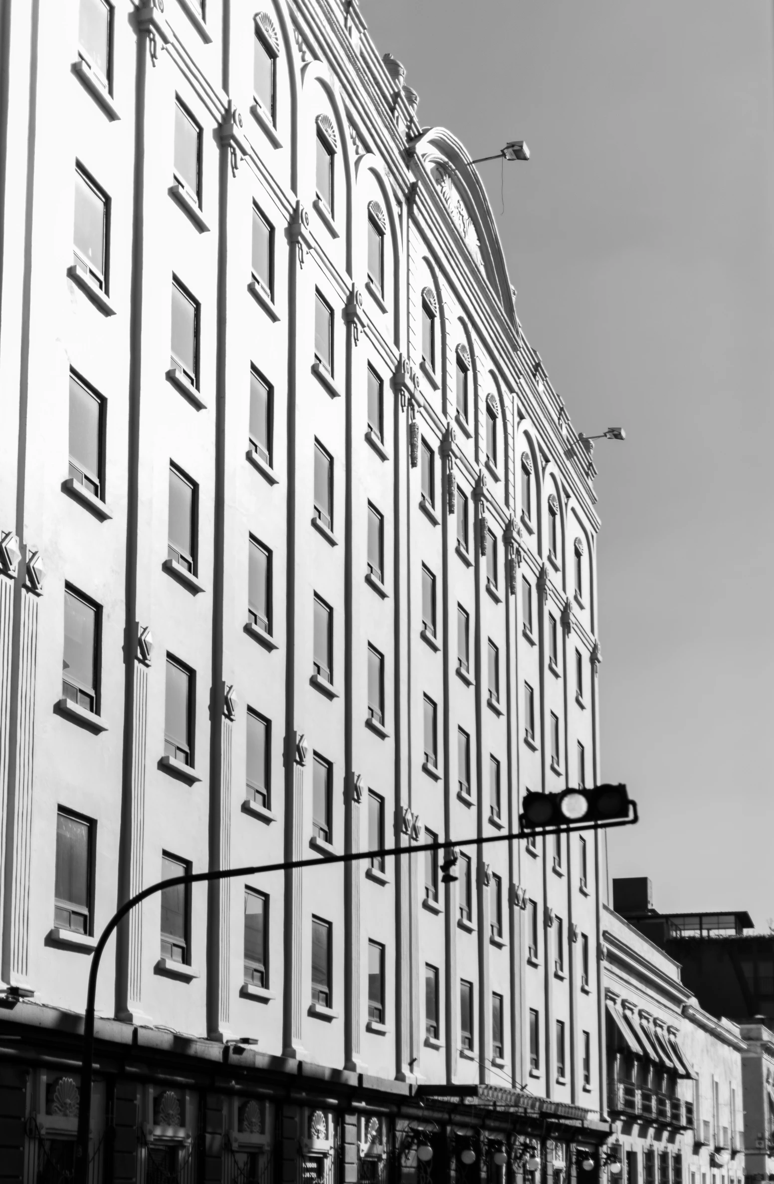 a tall building sitting next to a traffic light