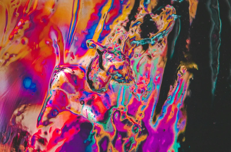 a colorful painting with small bubbles on it