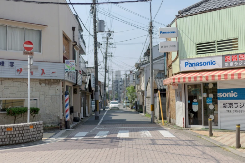 an empty street in front of buildings and businesses