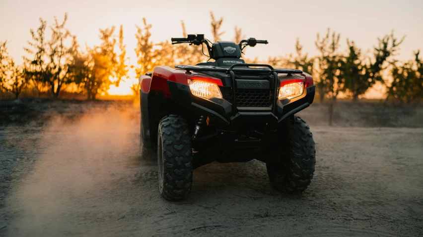 a man riding on the back of an atv