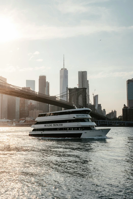 a large cruise boat is anchored at the dock next to an overpass