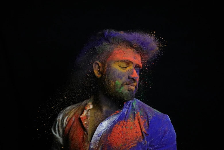 a man with paint all over his face and chest