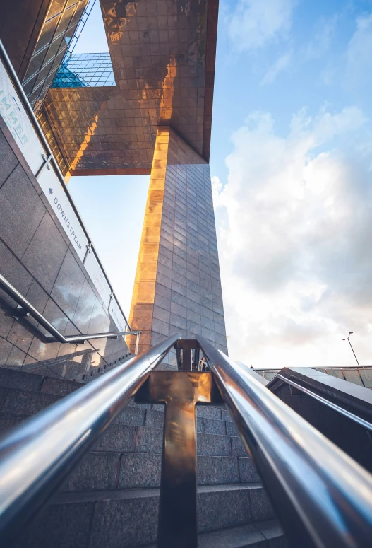 looking up at a very tall building next to stairs