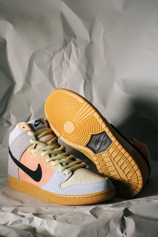 a pair of sneakers with an off - white and orange design on them